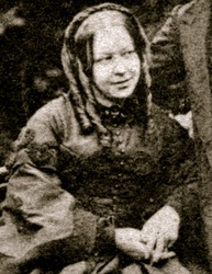 Susannah Spurgeon posed with the Inverted Baphomet Hand Sign